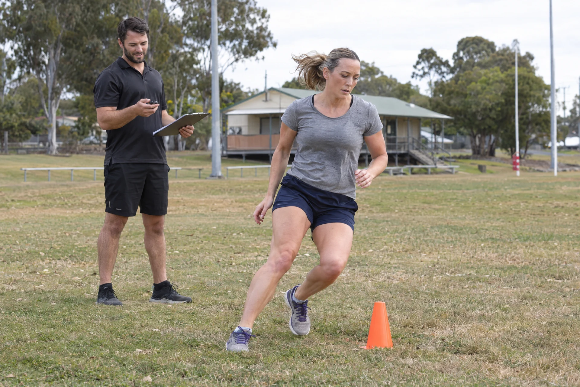 Coach timing an applicant during a Queensland practice assessment